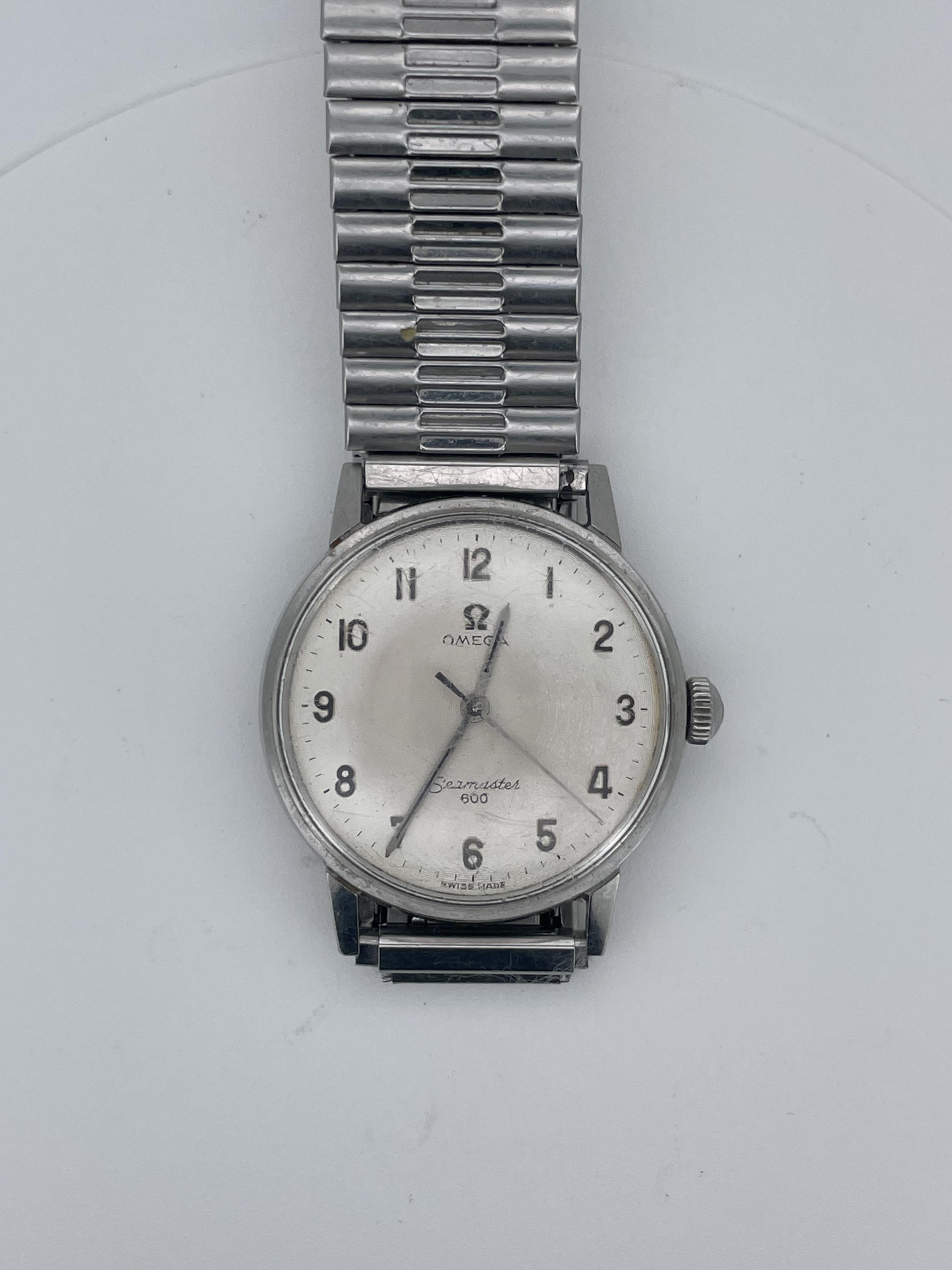 A gentleman’s Omega Seamaster 600 stainless steel automatic wristwatch, silvered engine turned dial with silver Arabic numerals, silvered pencil hands with black insert and centre sweep seconds, case diameter associated